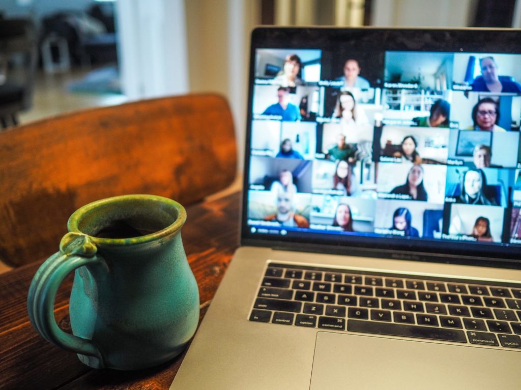A photo of a group talking on the computer
